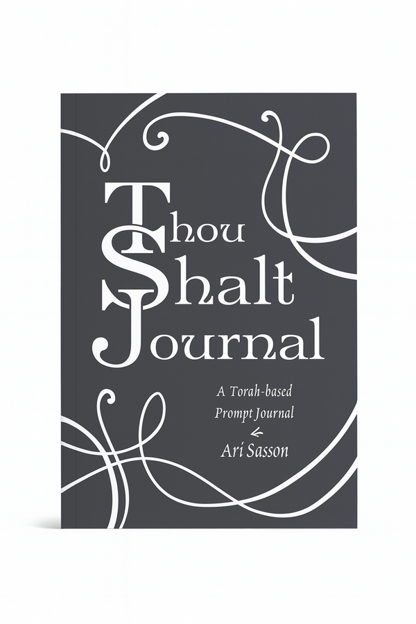 The cover of thou shalt journal. a decorative swirl is featured on the black and white cover